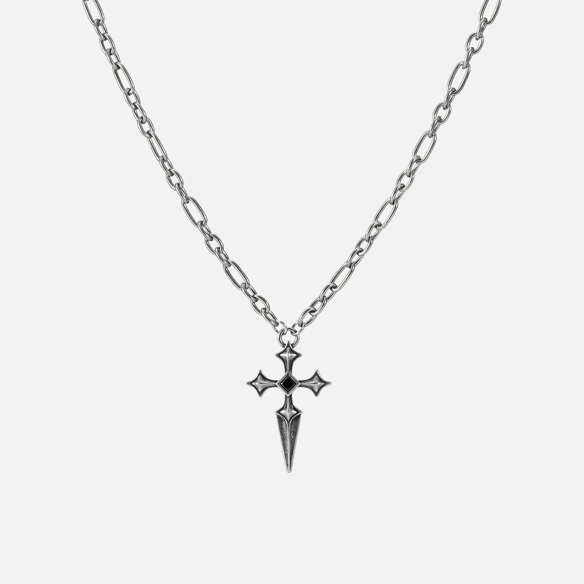 Vesper Blade Necklace in antiqued silver with a blade-shaped cross pendant and black obsidian, shown full length on white.