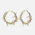 Gold-tone Vine Whispers hoop earrings shaped from twisting thorny branches