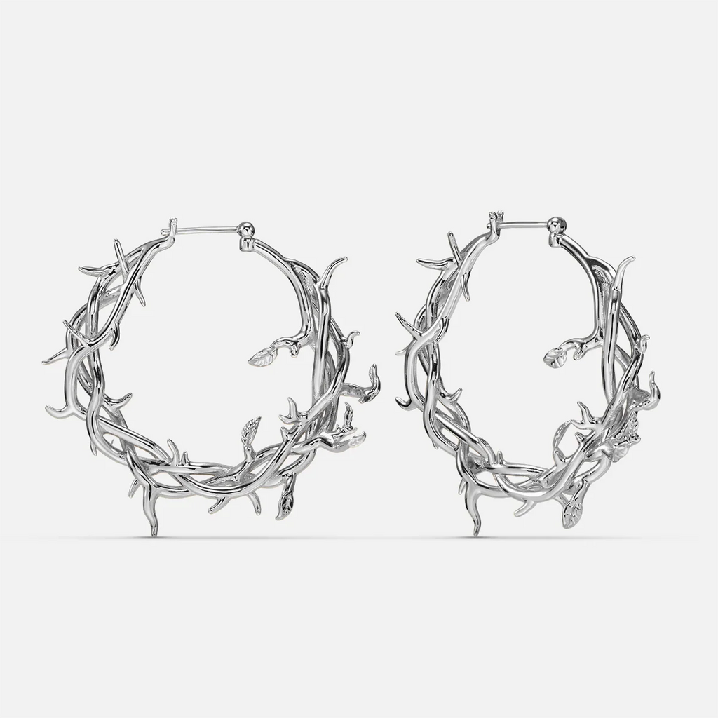 Pair of silver-tone hoop earrings featuring an intertwined vine and thorn design