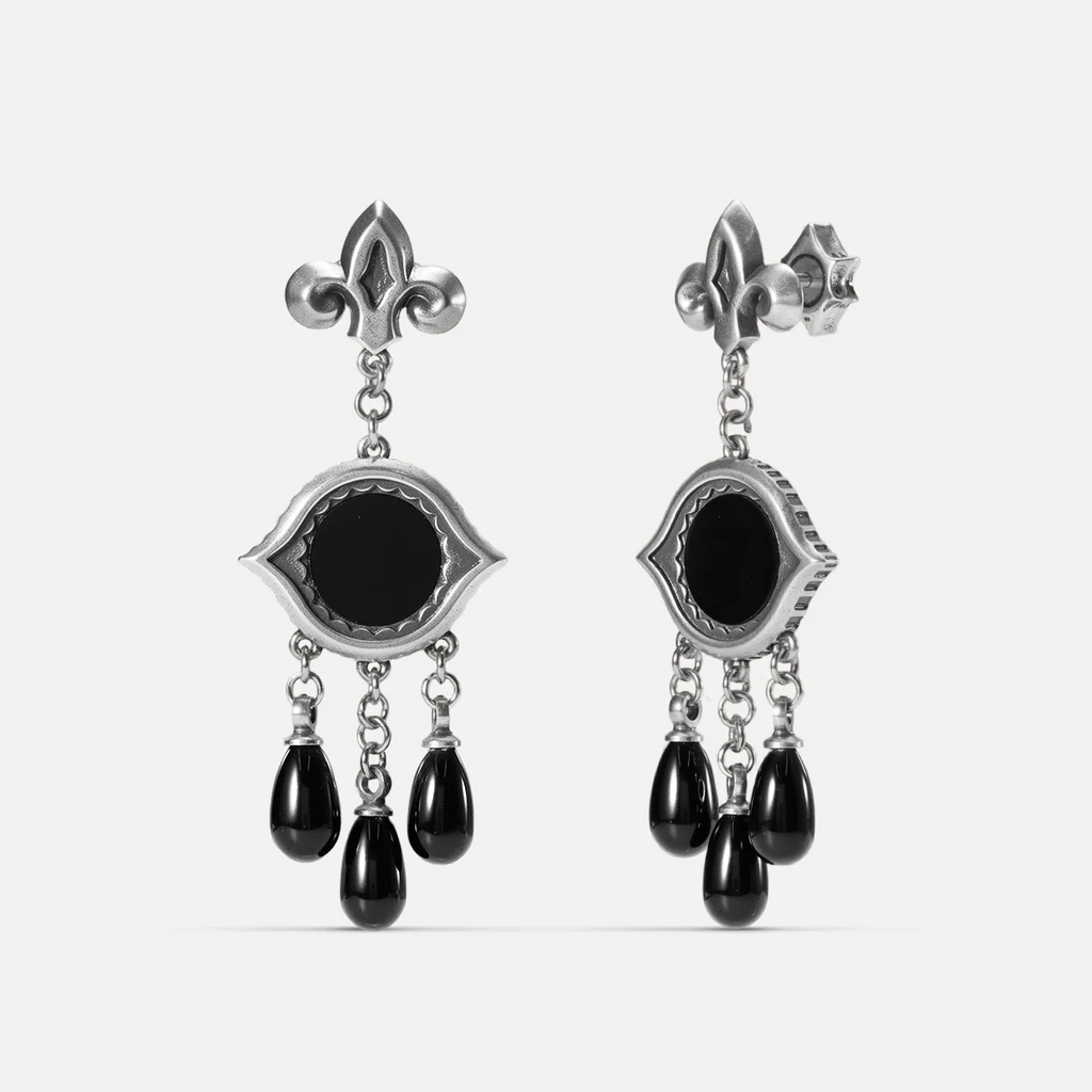 Antiqued silver-tone Votive Mirror Earrings shown from front and side views with round black obsidian centers, eye-shaped frames, and three suspended black drops.