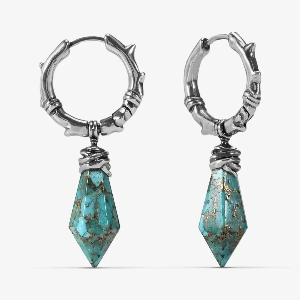 Silver-tone Wrapped Relic Earrings feature turquoise dagger drop stones and a hammered hoop design.